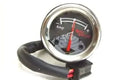 Analog ammeter gauge with black face, white scale, red needle, black mounting clamp