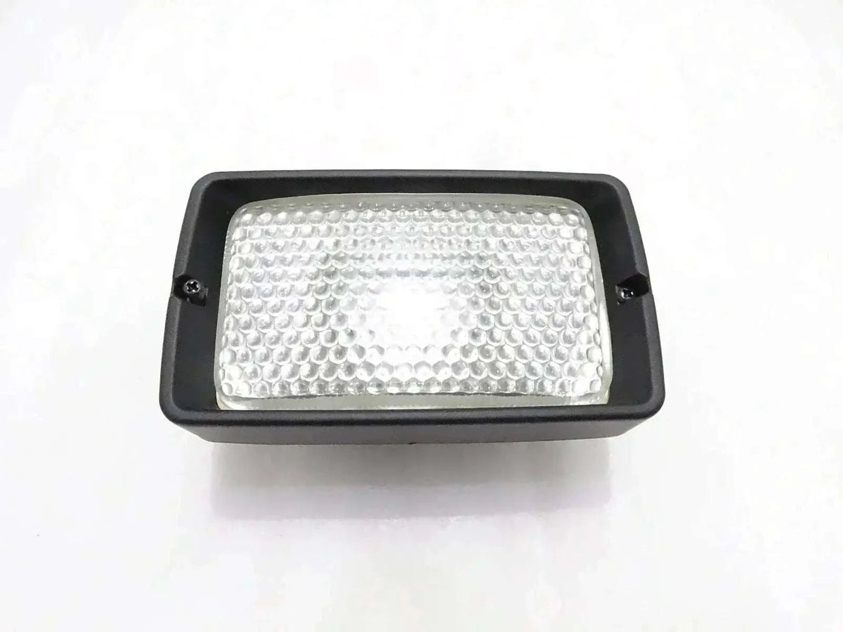 Front working light, rectangular black housing with clear textured lens
