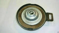Diesel fuel cap with metal lid, rubber gasket, and mounting bracket