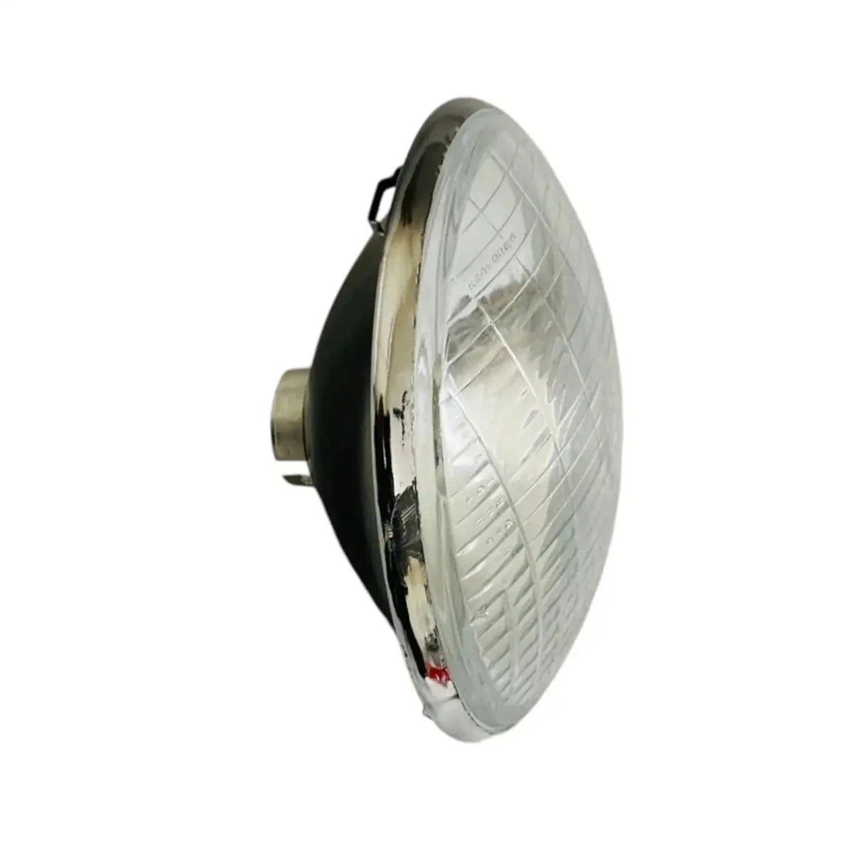 Sealed headlamp with clear lens and chrome housing, side profile and mounting tabs