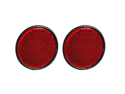 Set of 4 round red reflectors for tractor trailers, enhancing on-road visibility.